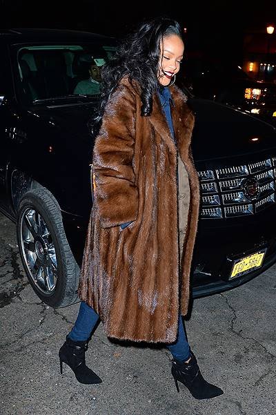 Rihanna rocks a big fur coat and all denim jumpsuit while out in NYC