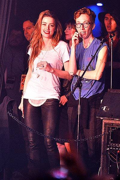 EXCLUSIVE: Amber Heard is all smiles as she watches fiance Johnny Depp perform with Steven Tyler, Marilyn Manson, and Alice Cooper at a private charity show in Anaheim, CA