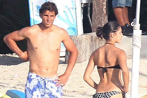 Rafael Nadal goes shirtless while his girlfriend Maria Xisca Perello bares her bikini body while spending a romantic time in the sea of Cancun, Mexico