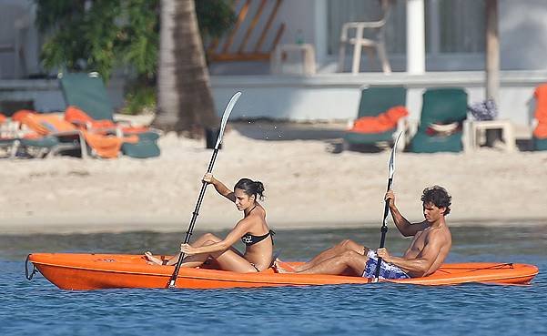 Rafael Nadal goes shirtless while his girlfriend Maria Xisca Perello bares her bikini body while spending a romantic time in the sea of Cancun, Mexico