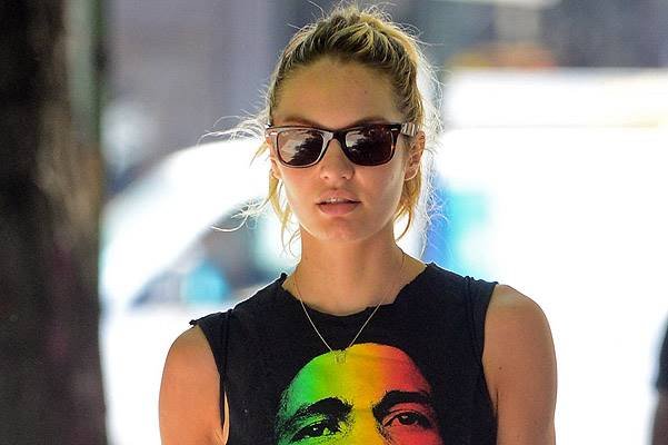 EXCLUSIVE: Candice Swanepoel wears Bob Marley shirt and leopard tights in Soho, NYC