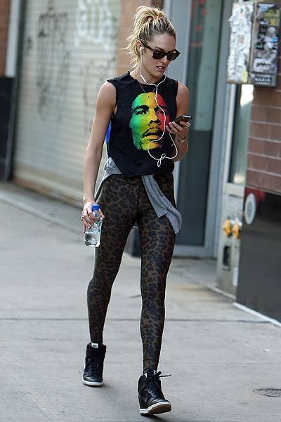 EXCLUSIVE: Victoria Secret model Candice Swanepoel walks around SoHo with a Bob Marley t-shirt and leopard tights in New York City