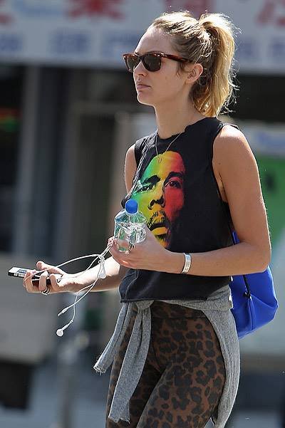 EXCLUSIVE: Victoria Secret model Candice Swanepoel walks around SoHo with a Bob Marley t-shirt and leopard tights in New York City