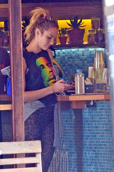 EXCLUSIVE: Candice Swanepoel wears Bob Marley shirt and leopard tights in Soho, NYC