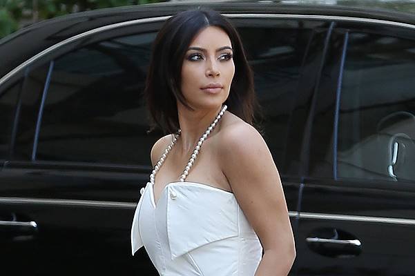 Kim Kardashian dressed all in white as she films Keeping up with the Kardashians at a Beverly Hills hotel