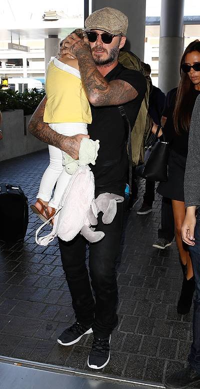 David and Victoria Beckham leave Los Angeles International (LAX) airport with their children Featuring: Harper Beckham,David Beckham,Victoria Beckham Where: Los Angeles, California, United States When: 31 May 2014 Credit: WENN.com