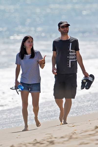 EXCLUSIVE: Courteney Cox shares a tender kiss with her boyfriend while walking on the beach in Malibu