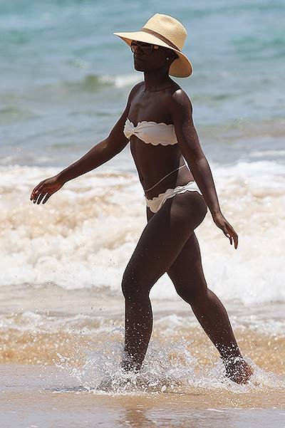 EXCLUSIVE: Lupita Nyong'o in a white bikini in Hawaii