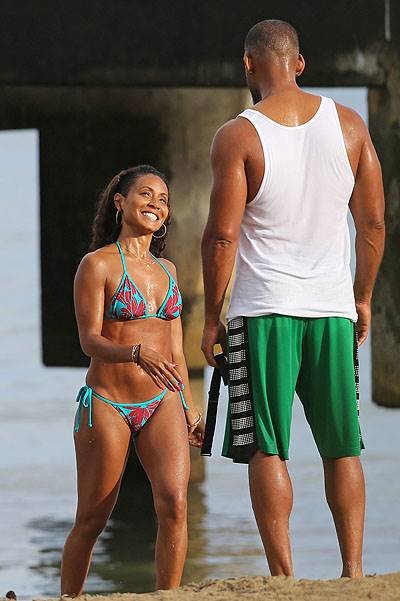 EXCLUSIVE: **PREMIUM RATES APPLY** A bikini clad Jada Pinkett Smith and Will Smith workout together and show some PDA on the beach in Hawaii