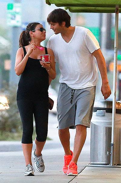 *EXCLUSIVE* Ashton and Mila feed her cravings with a Frozen Yogurt and a Kiss