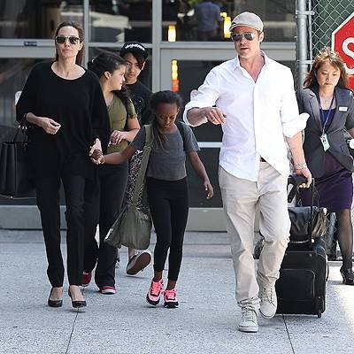 Brad Pitt and Angelina Jolie arrive at LAX with the kids