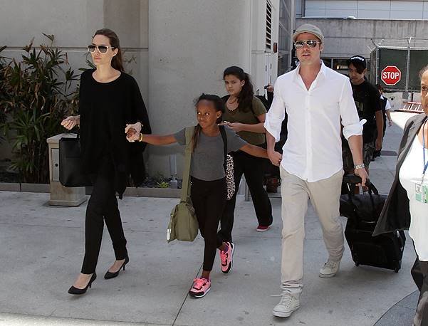 Angelina Jolie and Brad Pitt arrive back in Los Angeles with Maddox and Zahara
