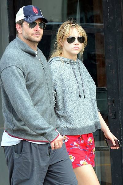 EXCLUSIVE: Actor Bradley Cooper and his girlfriend Suki Waterhouse stop and chat with some friends as they walk hand in hand along Abbot Kinney Boulevard in Venice, CA after having breakfast at 3 Square Cafe