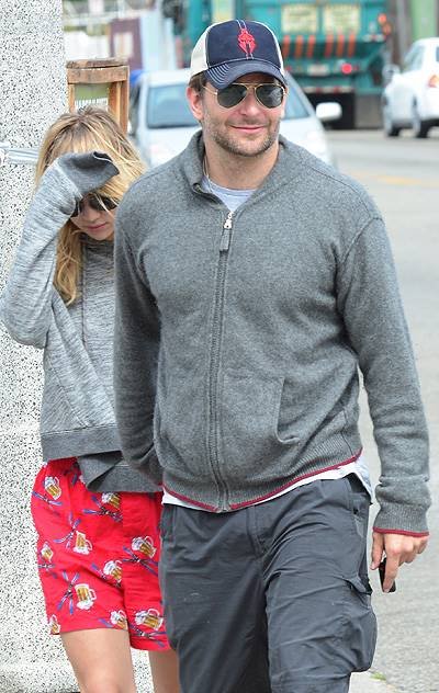 EXCLUSIVE: Actor Bradley Cooper and his girlfriend Suki Waterhouse stop and chat with some friends as they walk hand in hand along Abbot Kinney Boulevard in Venice, CA after having breakfast at 3 Square Cafe