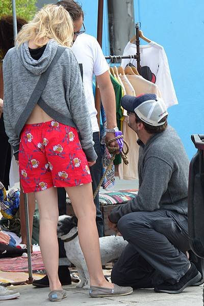 EXCLUSIVE: Actor Bradley Cooper and his girlfriend Suki Waterhouse stop and chat with some friends as they walk hand in hand along Abbot Kinney Boulevard in Venice, CA after having breakfast at 3 Square Cafe