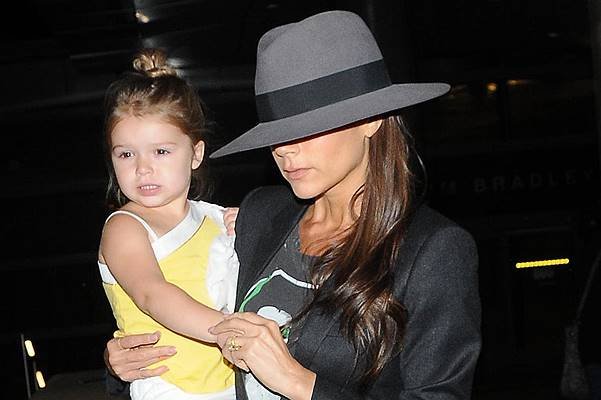 Victoria Beckham arrives at Los Angeles International (LAX) airport carrying daughter Harper Featuring: Victoria Beckham,Harper Beckham Where: Los Angeles, California, United States When: 18 Jul 2014 Credit: WENN.com