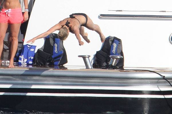 Seal seen enjoying a holiday on a yacht in Sardinia with a mystery blonde woman and some friends