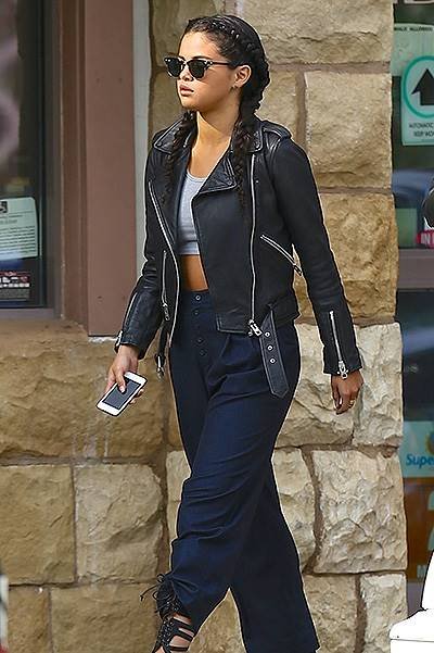 EXCLUSIVE: Selena Gomez steps out in a crop top, leather jacket and braided hair