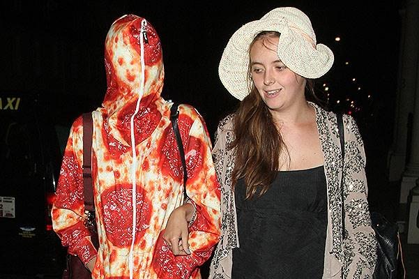 Cara Delevingne arriving home from Ibiza wearing a Pepperoni Pizza Onesie