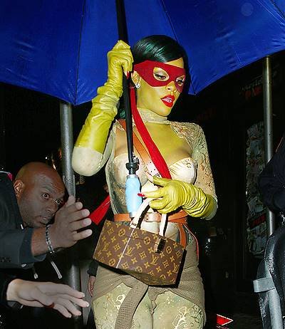 Umbrella-ella-ella!  Rihanna dressed up as Raphael from Teenage Mutant Ninja Turtles carries an umbrella when out clubbing in the rain on Halloween night in NYC