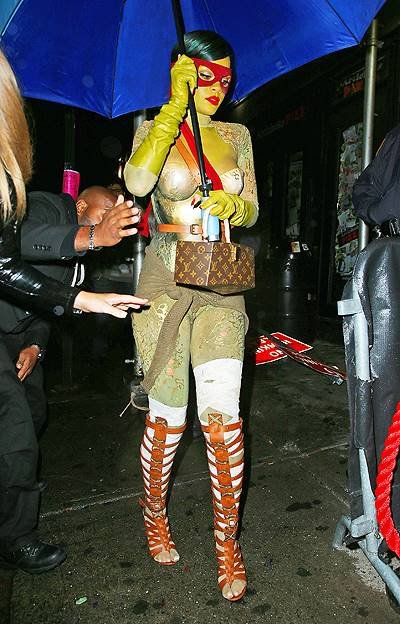 Umbrella-ella-ella!  Rihanna dressed up as Raphael from Teenage Mutant Ninja Turtles carries an umbrella when out clubbing in the rain on Halloween night in NYC