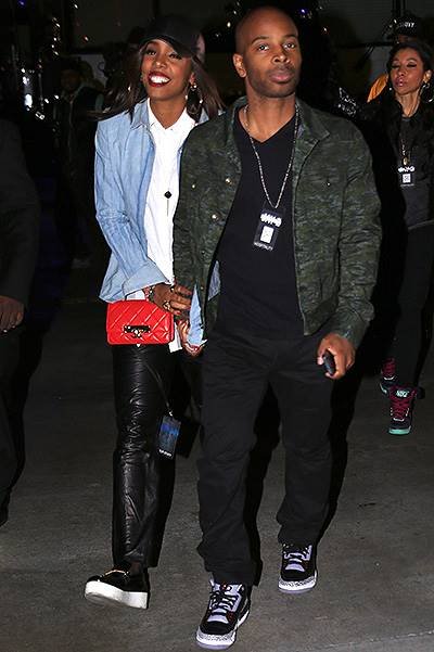Kelly Rowland and fiance Tim Witherspoon hold hands as they leave the Jay Z concert at the Staples Center in Los Angeles on Monday night