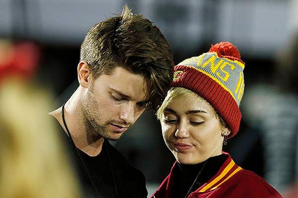 Miley Cyrus and Patrick Schwarzenegger sighting at USC football game