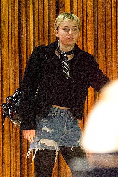 EXCLUSIVE: **PREMIUM RATES APPLY** Miley Cyrus meets Patrick Schwarzenegger's friends as they are spotted outside Mr Nice Guy in West Hollywood