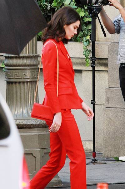 Kendall Jenner seen in a red suit for a photo shoot